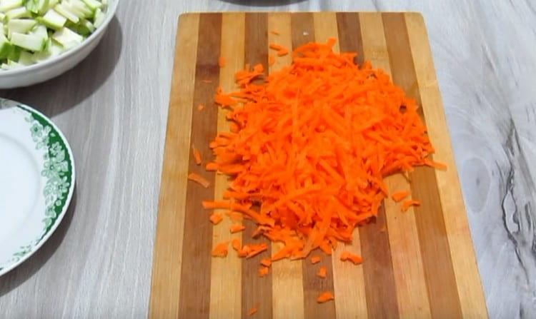 Grate carrots.