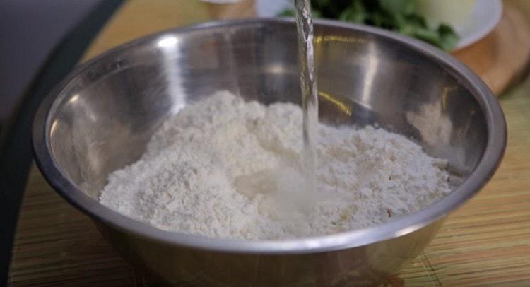 Add water to the sifted flour.