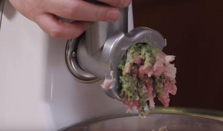 Together with meat, we also pass cilantro and onion through a meat grinder.