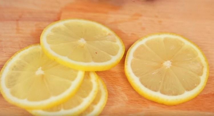 Wash lemon and cut into circles.