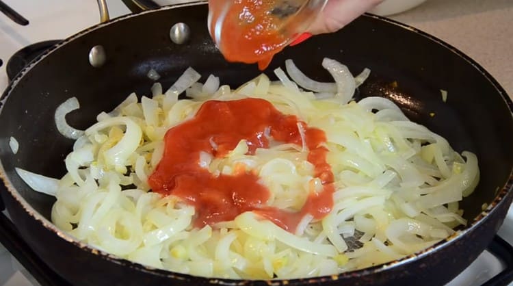 Add tomato paste or grated tomatoes to the onion.