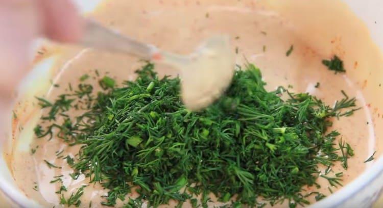 Add garlic and finely chopped greens to the sauce.