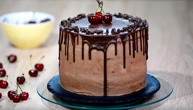 Here we have such a magnificent chocolate cake with cherries.