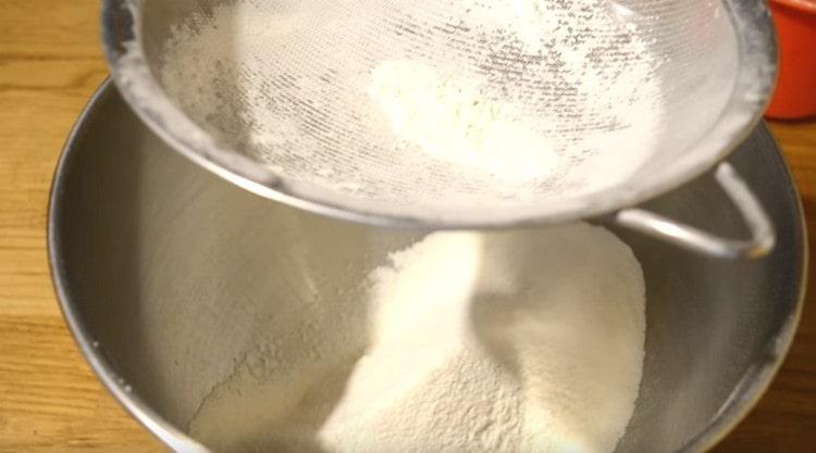 Sift flour into a bowl for kneading dough.