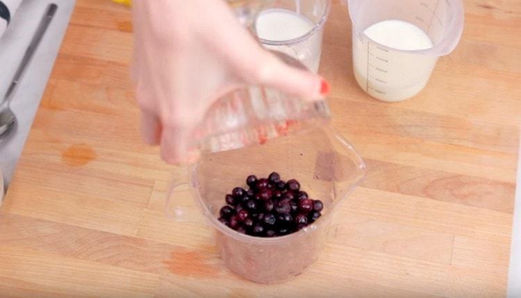 Pour blueberries into a blender bowl.