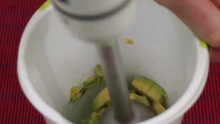 To make sandwiches with avocado and red fish, put the ingredients in a blender bowl