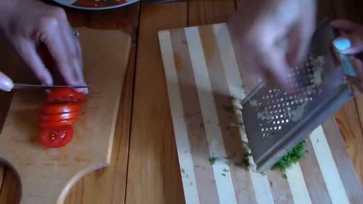 To make quick pizza in the oven, chop the tomatoes