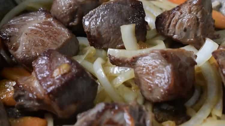 To cook beef stew with vegetables, saute the meat