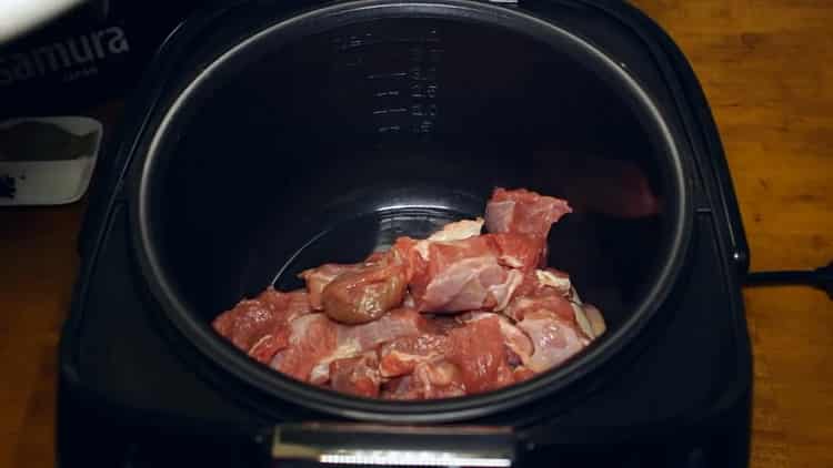 To cook beef goulash in a slow cooker, fry the meat