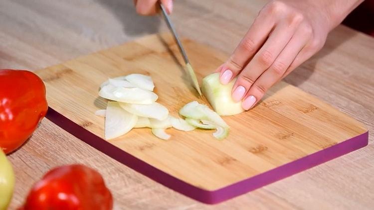 To chop chicken quesadillas, chop the onion