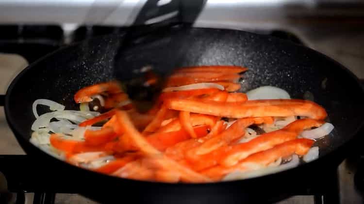 Fry vegetables to make chicken quesadillas