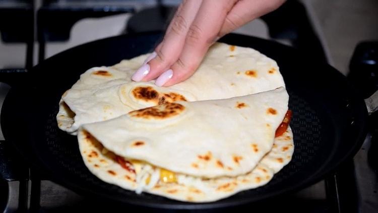 To make chicken quesadilla, fry the tortilla