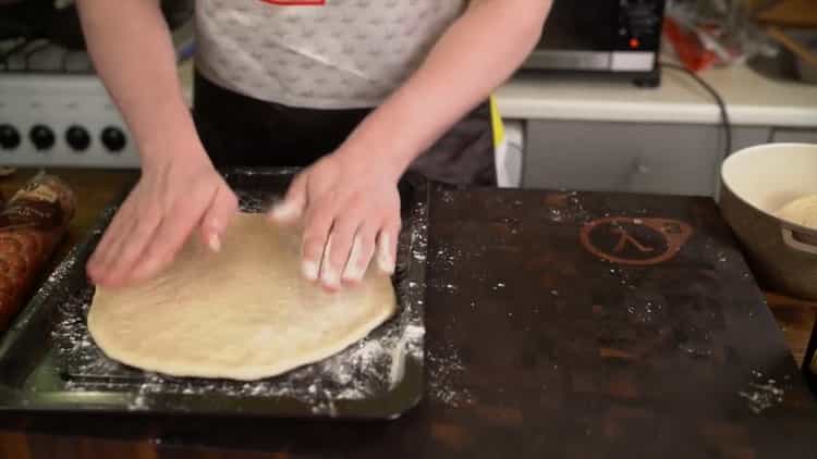 To make a classic pizza, put the dough in a mold