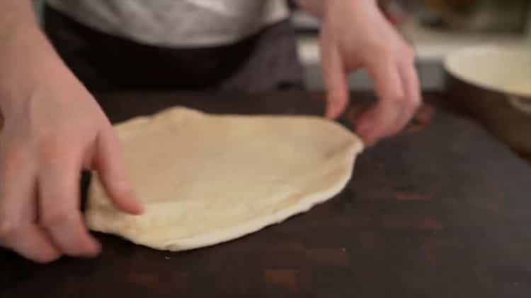To make a classic pizza, roll the dough