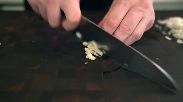 To make a classic pizza, chop the garlic