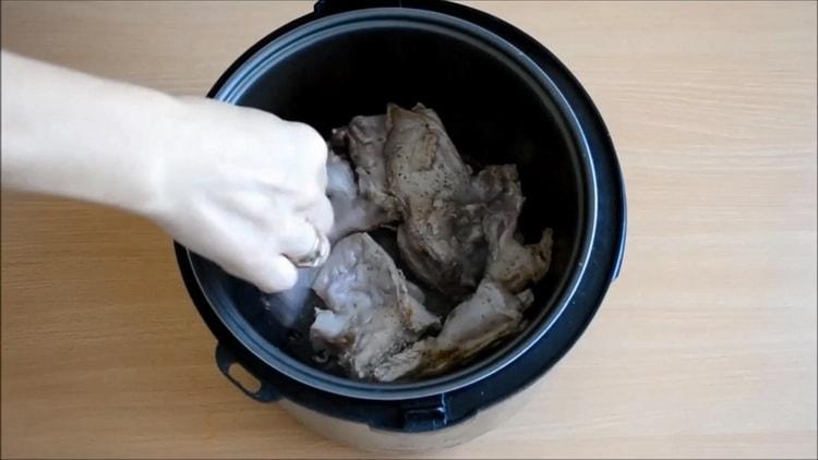 To cook a rabbit in a slow cooker, fry the meat