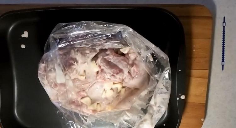 To cook a rabbit in sour cream in the oven, preheat the oven