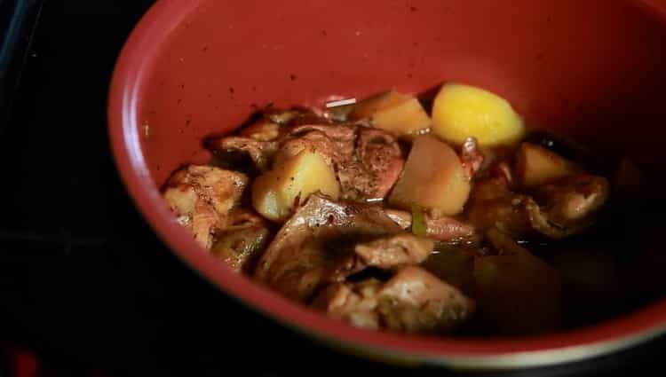 To cook a rabbit with potatoes in a slow cooker, mix the ingredients