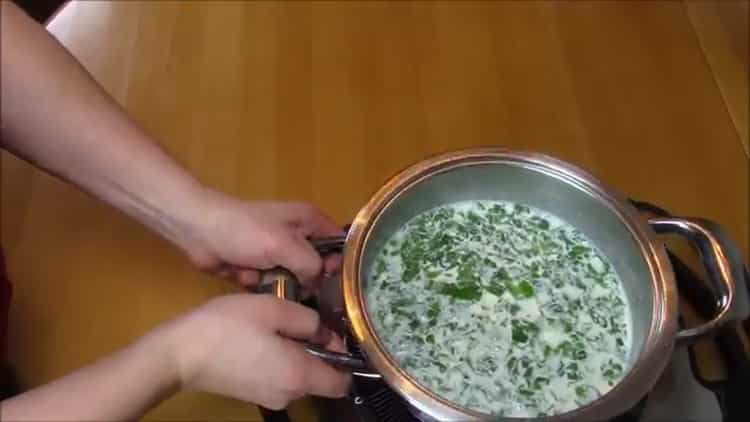 To cook chicken breast in a creamy sauce, chop the greens