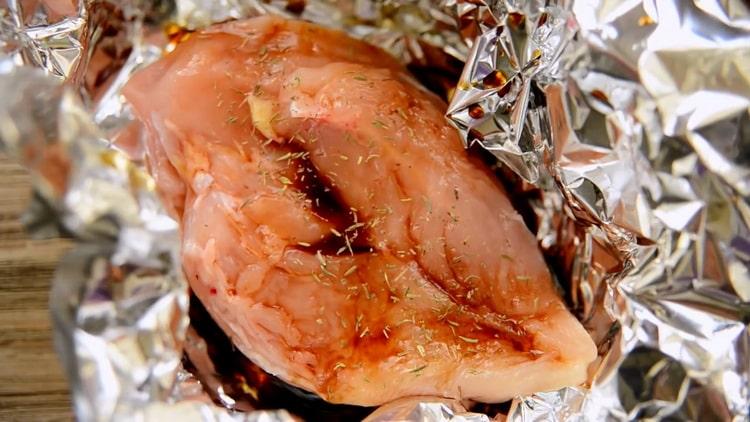 To make chicken breast in foil in the oven, prepare herbs