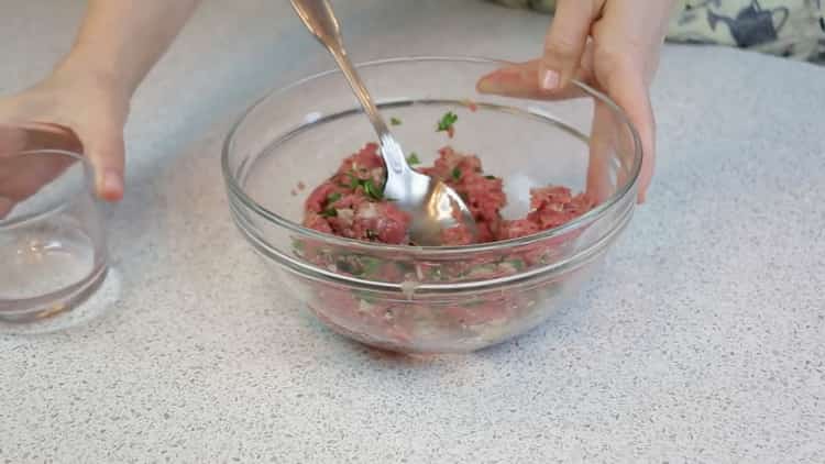 To cook manti in the oven, mix the minced ingredients