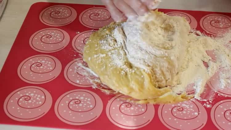 To make a honey cake with sour cream, knead the dough
