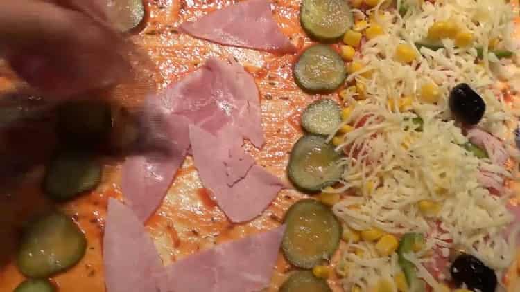 To make pizza toppings, put olives on cheese