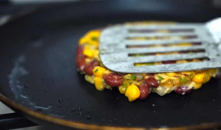 To cook vegetable cutlets, heat a frying pan