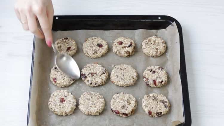 To prepare oatmeal cookies with a banana, lay out the ingredients and a baking sheet
