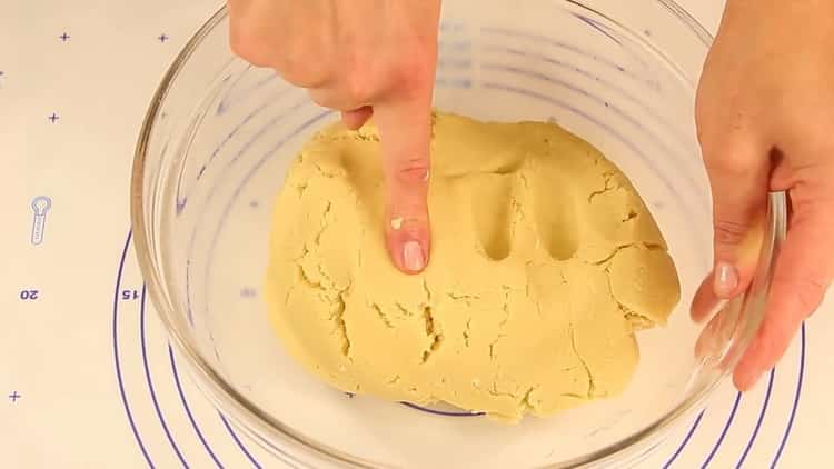 To prepare shortbread cookies through a meat grinder, knead the dough