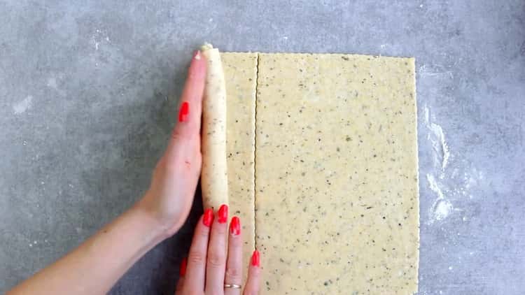 Roll out the dough to make cookies from processed cheese