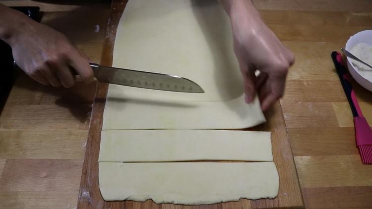 To make cookies from puff yeast dough, cut the dough