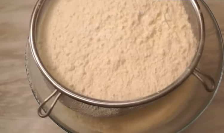 Sift flour to make kefir cookies
