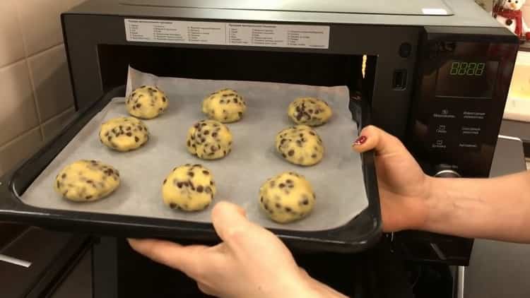 To bake cookies with chocolate chips, put the baking sheet in the oven