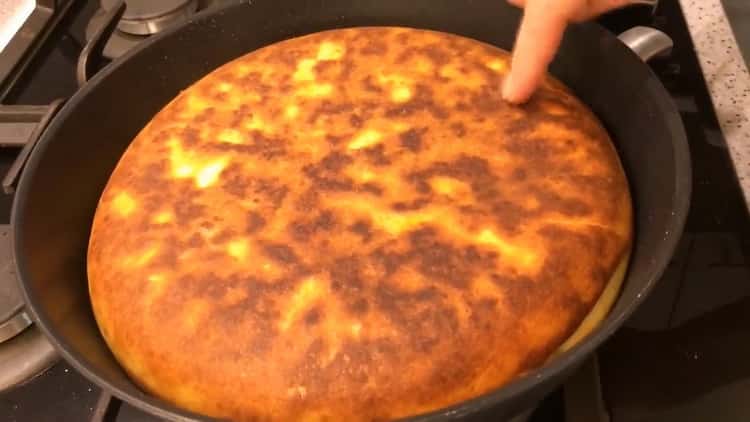 Fry the cake in a pan on both sides.
