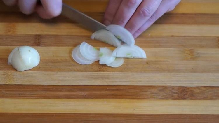 To make a mushroom pie in the oven, chop the onion for the filling