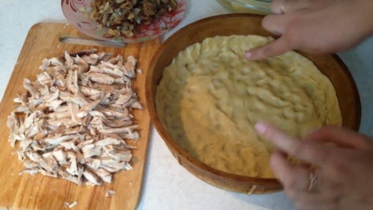 To make a chicken pie, prepare a mold