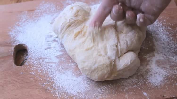 To make pizza in the oven, knead the dough