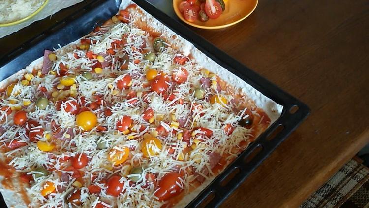 To make lavash pizza in the oven, turn on the oven