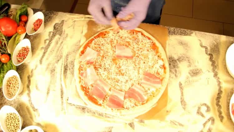 To make carbonara pizza, put the bacon on the dough