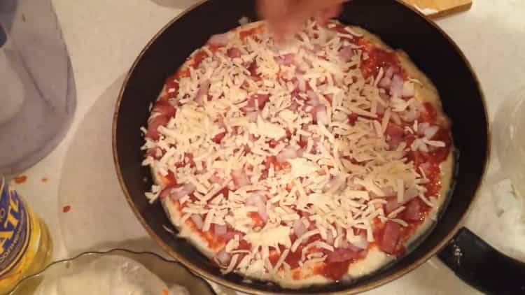 Grate cheese to make pizza