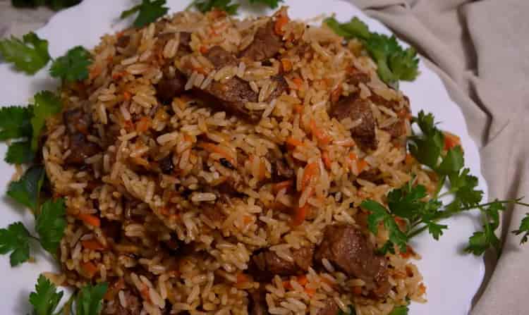 lamb pilaf in a cauldron is ready