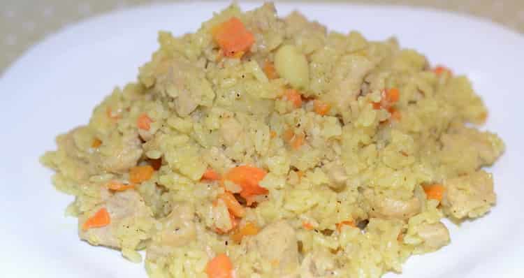 Delicious pilaf with chicken cooked in a cauldron of goov