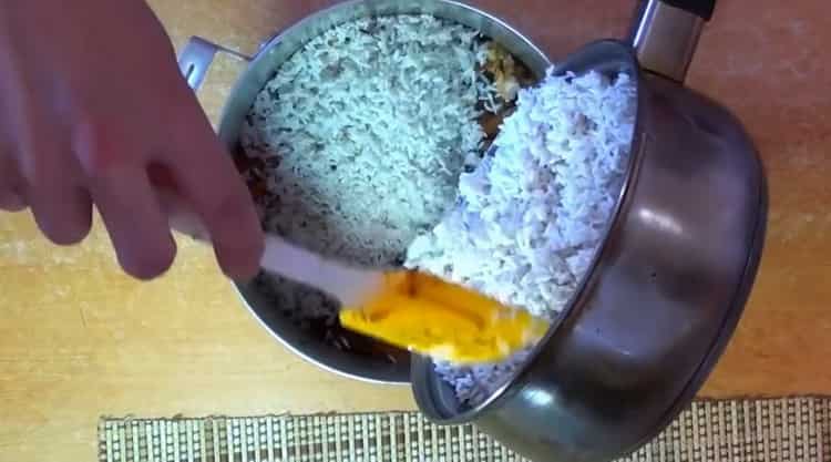 To cook pilaf with chicken in a pan, add rice