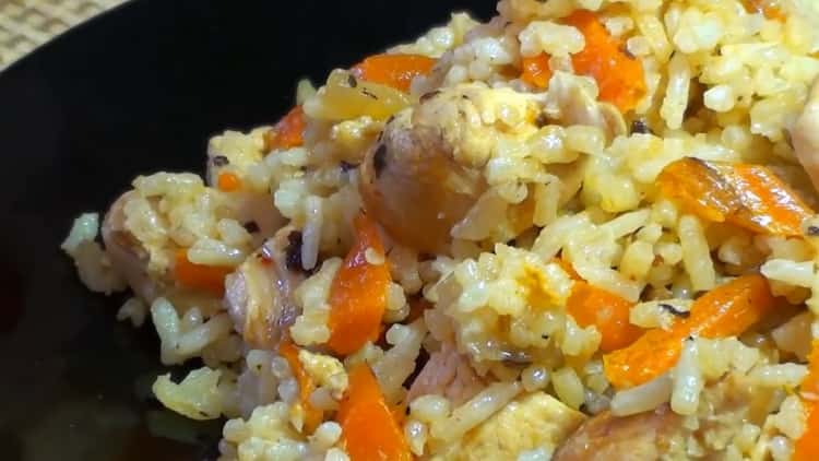 pilaf with chicken in a pan is ready