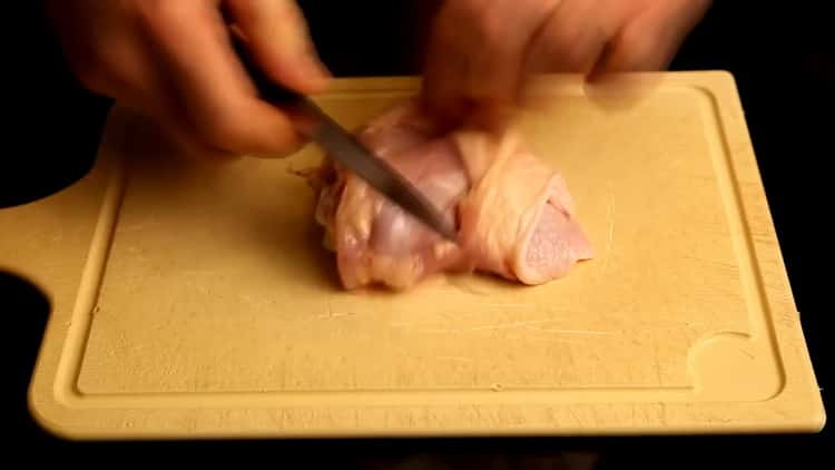To cook rice with chicken in the oven, chop the meat
