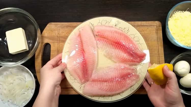 To make tilapia in the oven, cut the lemon