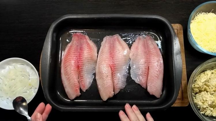 To make tilapia in the oven, prepare a baking sheet