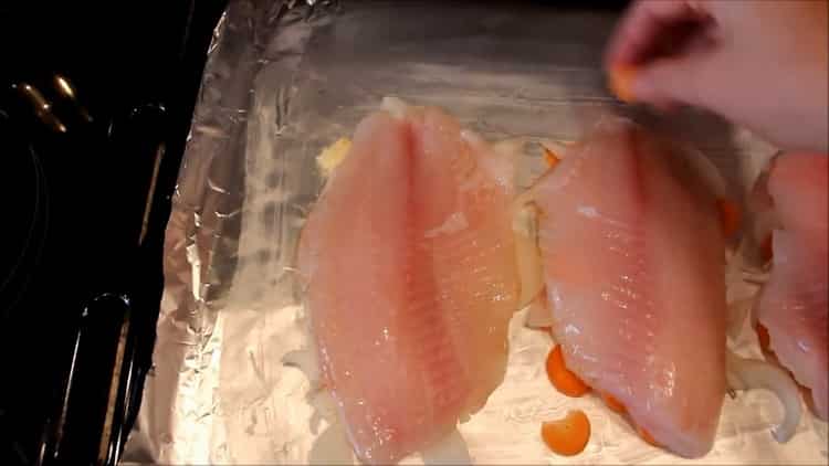 To cook fish in the oven, put the fish on a foil