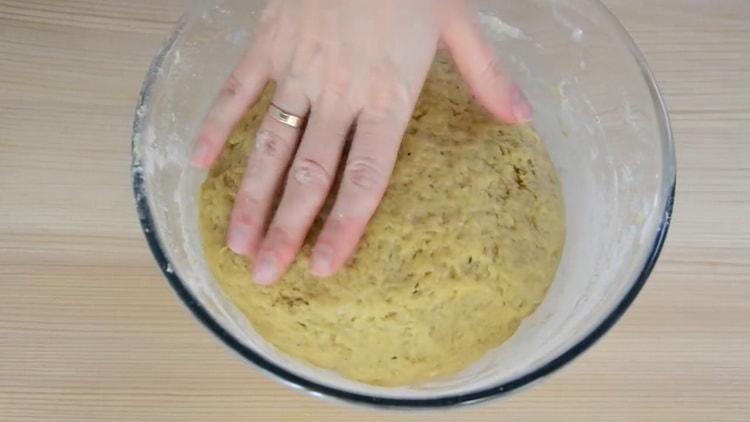 Knead the dough to make a Christmas cake.